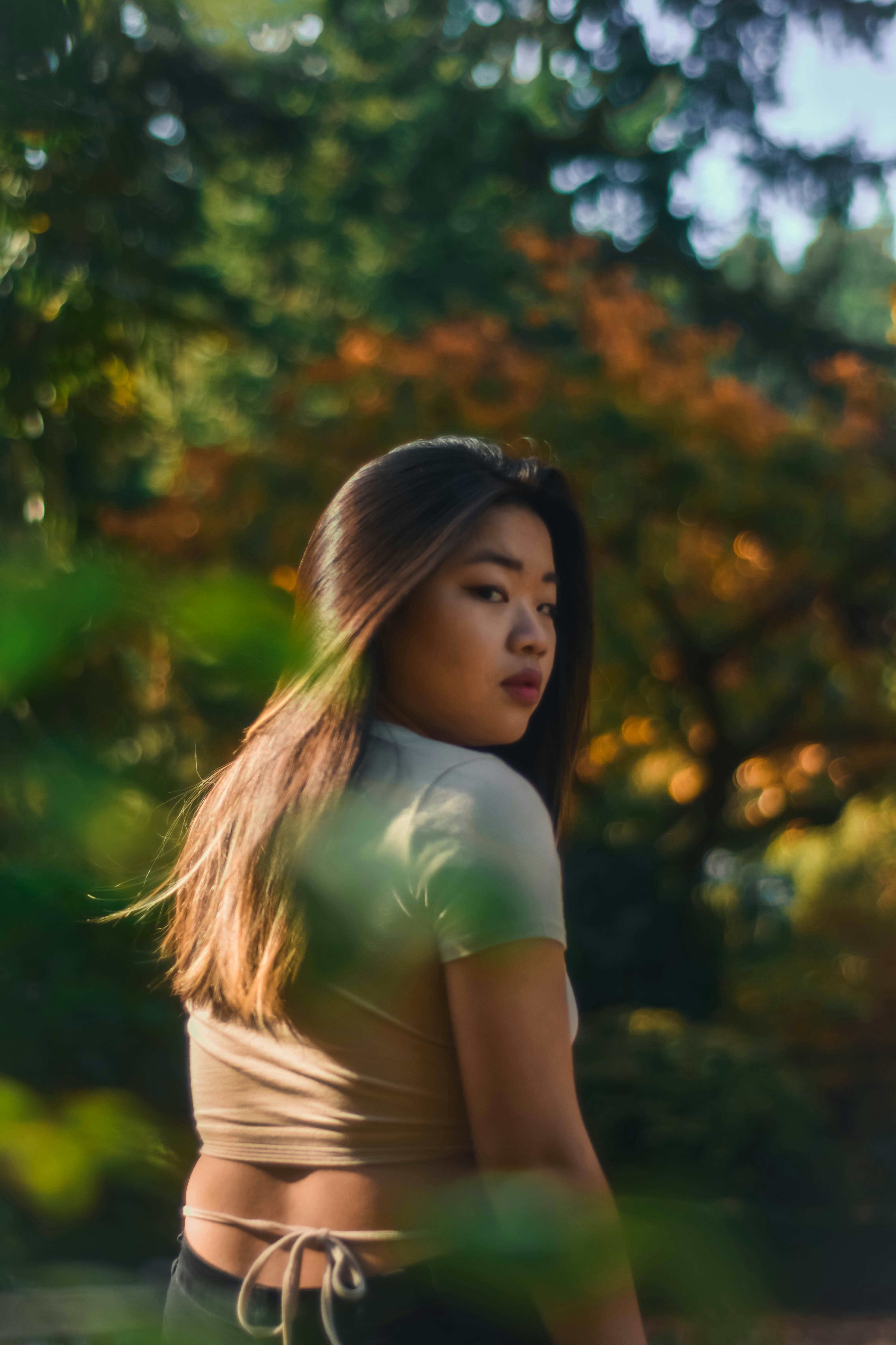 woman in brown crop top and black bottoms